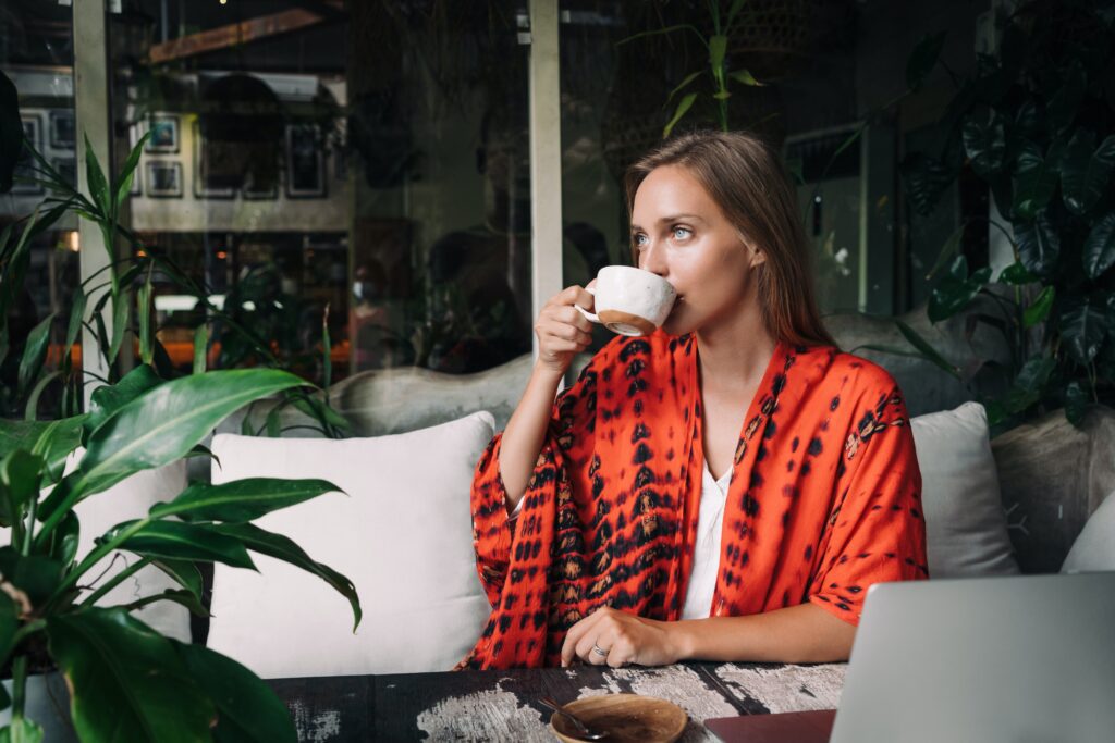 Woman sipping tea made from a Saffron Tea Recipe