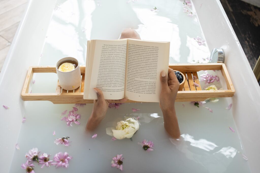 woman reading in tub with Lavender Bath Salts