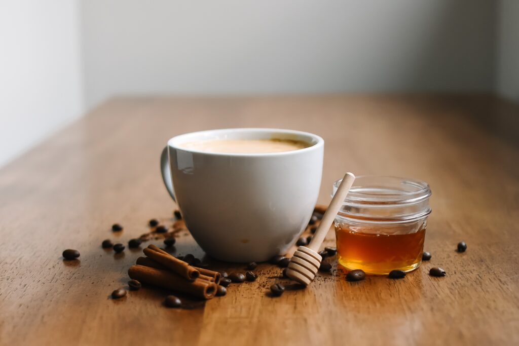 cinnamon and honey by tea cup for Mental Health Misconceptions post