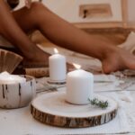 woman sitting by candles Tapping into Ancient Wisdom