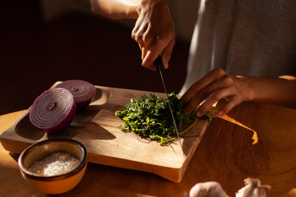 woman chopping cilantro