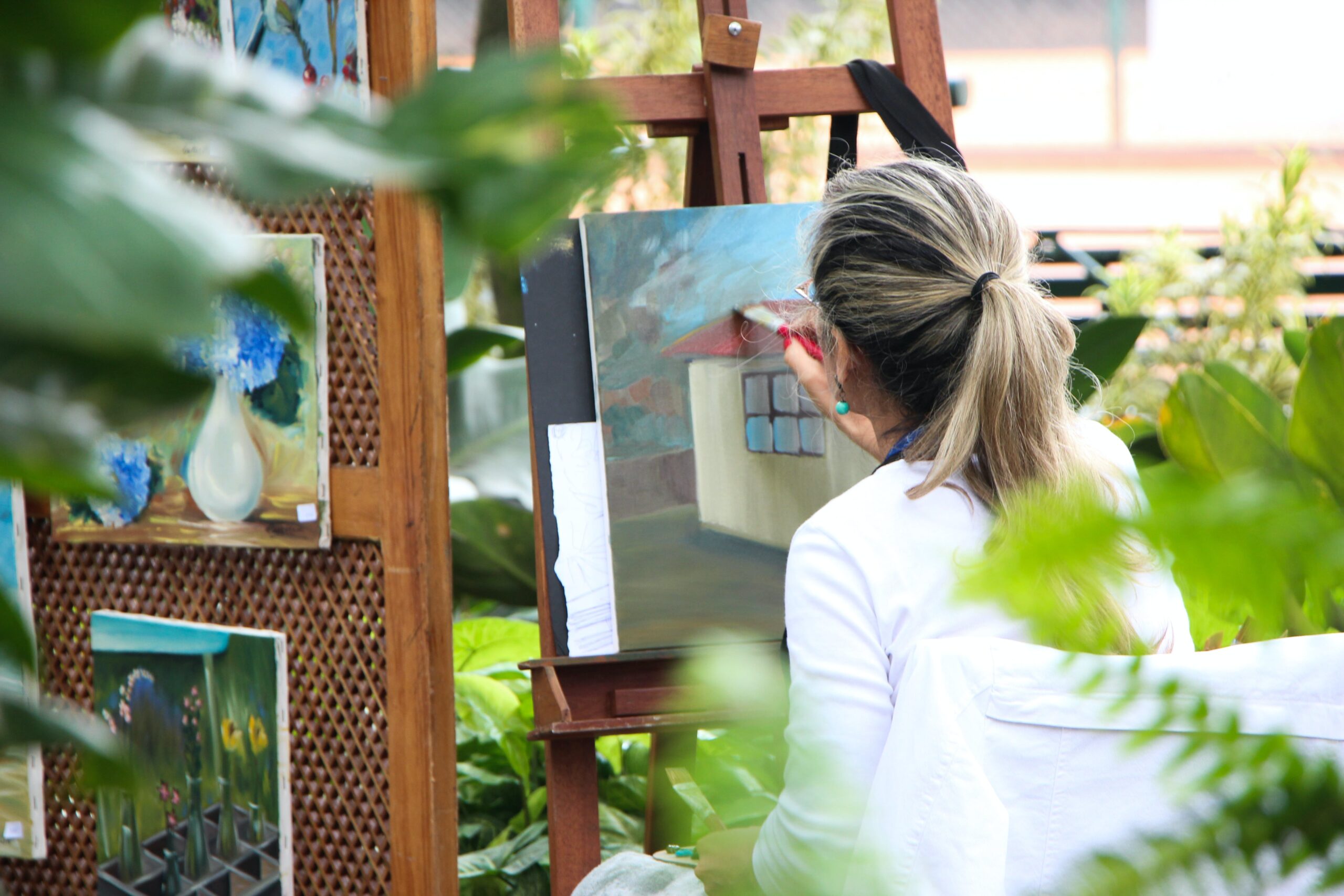 woman painting a part of Expressive Therapies