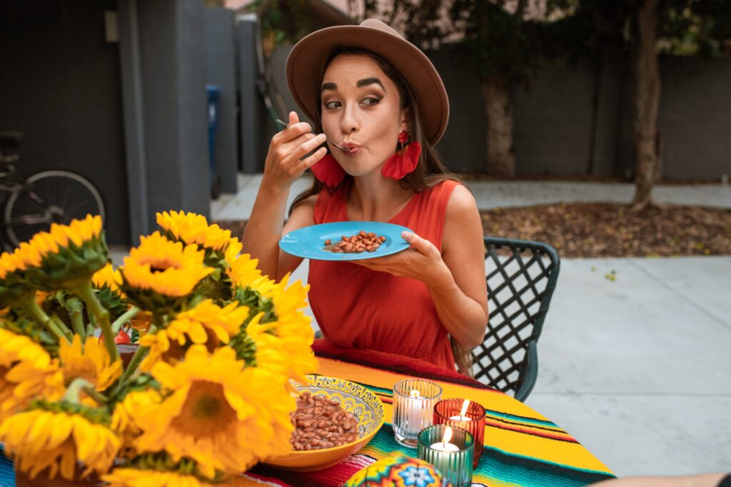 Woman eating outdoors for the Nourishing the Mind post