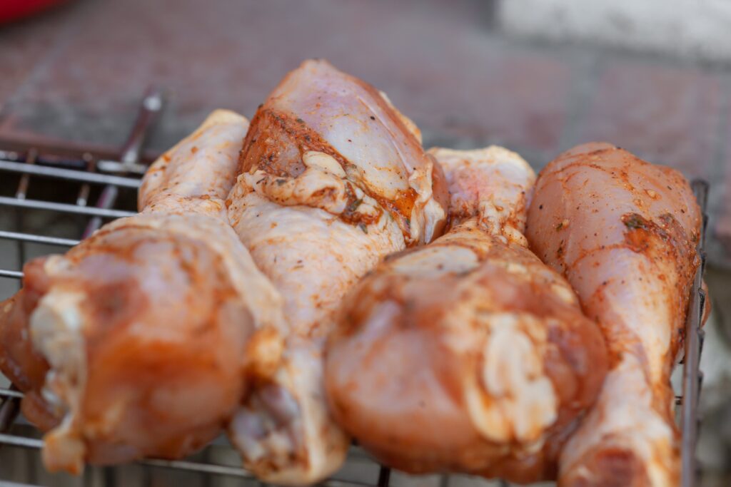 Chicken legs on grill for Saffron-Infused Chicken Tagine