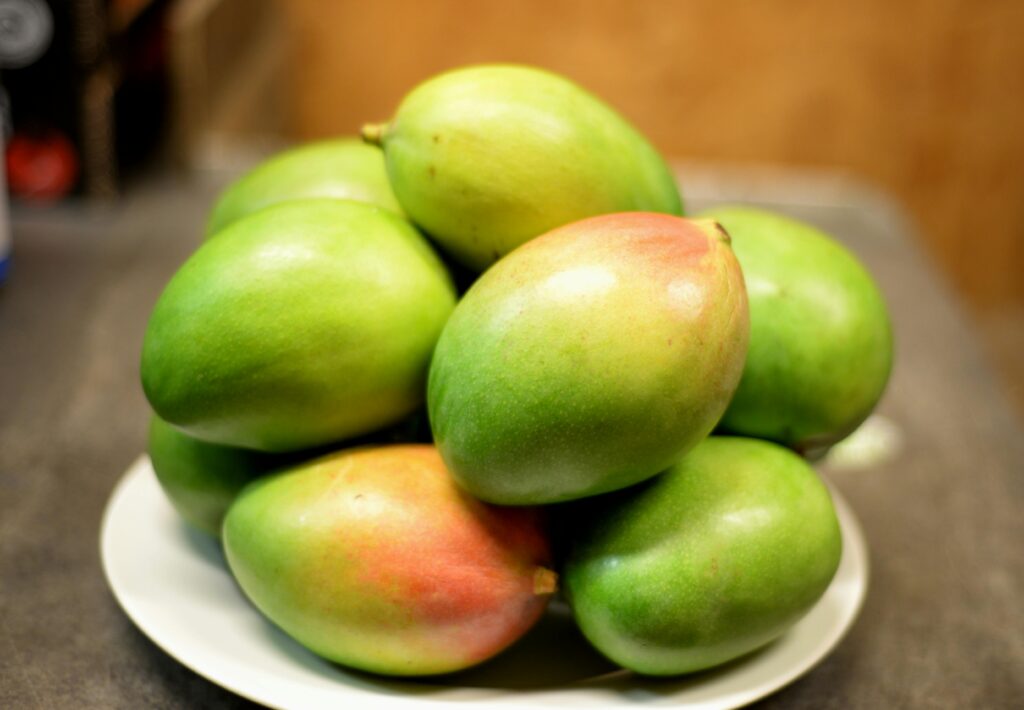 mangoes in a bowl for a Mango Avocado Quinoa Salad