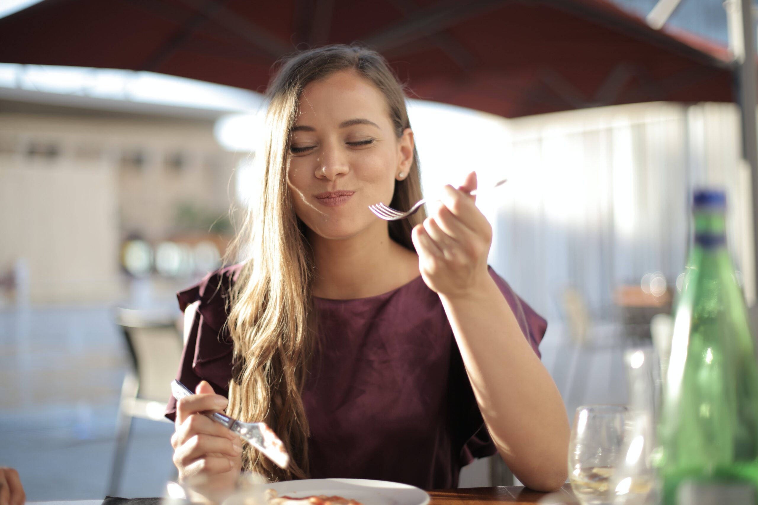 woman mindfully eating for holistic-wellness