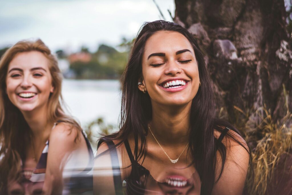 woman smiling for the Dopamine and mental health - neurotransmitter boosting motivation and mood post